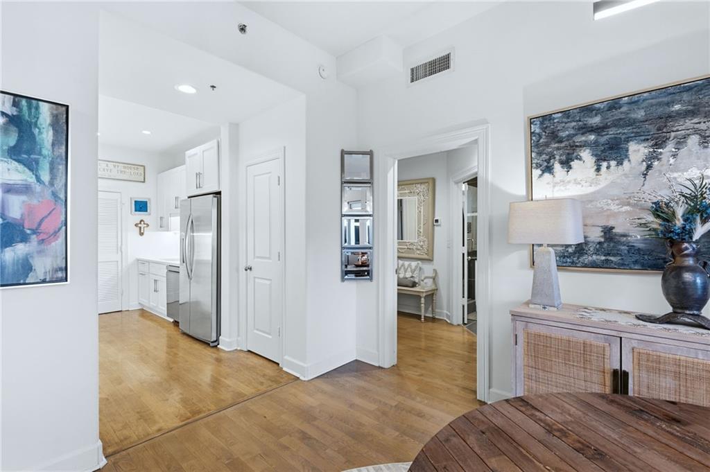 3445 Stratford Road Northeast, Unit 3703 Atlanta, GA 30326 - Photo 8 of 59 a bedroom with furniture and a fireplace