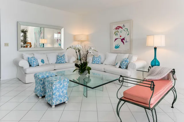 a living room with furniture and a lamp