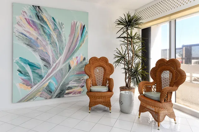 a living room filled with furniture and a floor to ceiling window