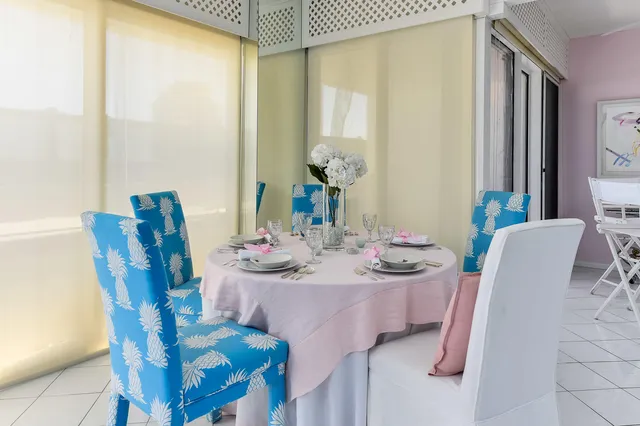 a dining room with furniture and wooden floor