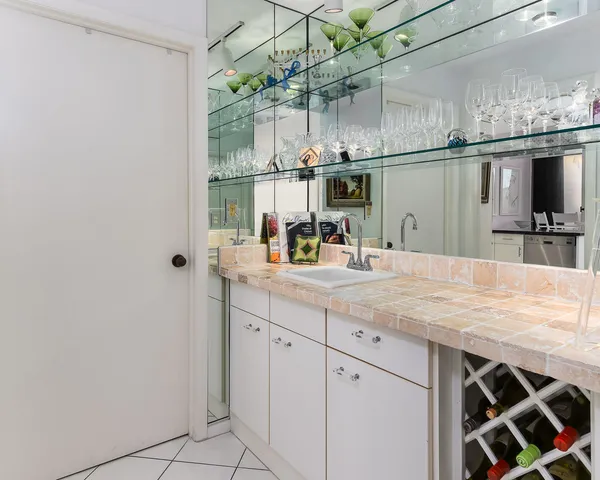 a kitchen with a sink and cabinets