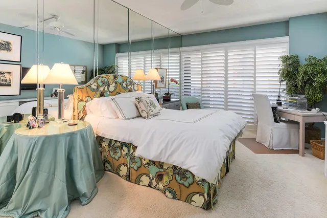 a bed room with a bed and a chair