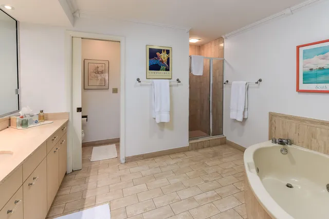 a bathroom with a tub sink and mirror