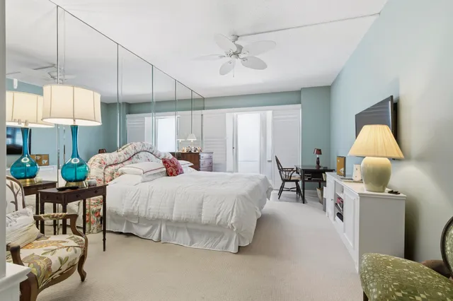 a bed room with a bed and a chandelier