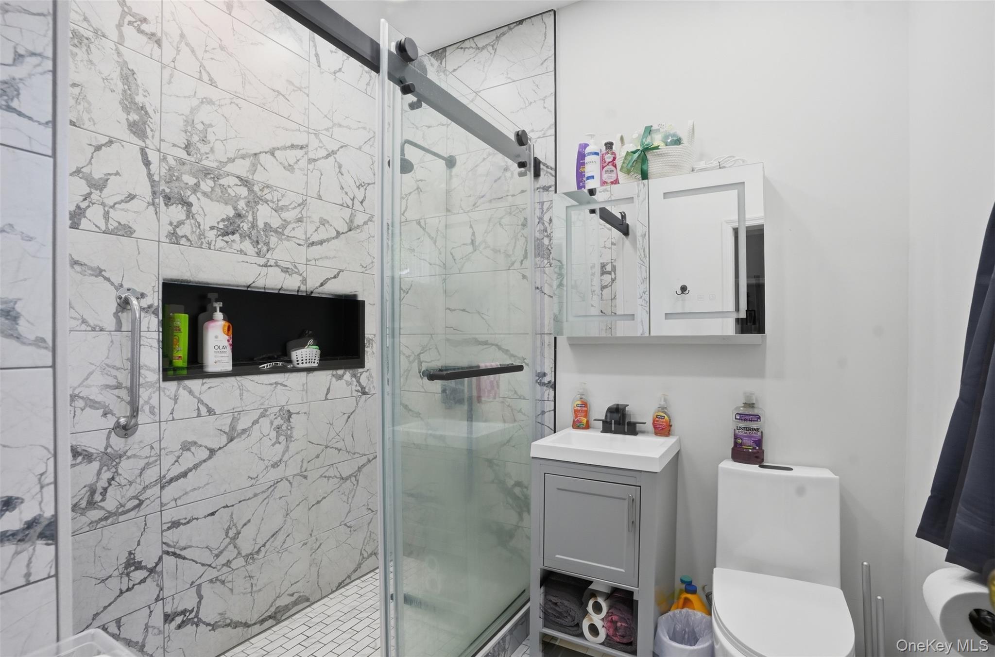 6 Short Road Wurtsboro, NY 12790 - Photo 20 of 48 a bathroom with a toilet sink vanity granite and shower