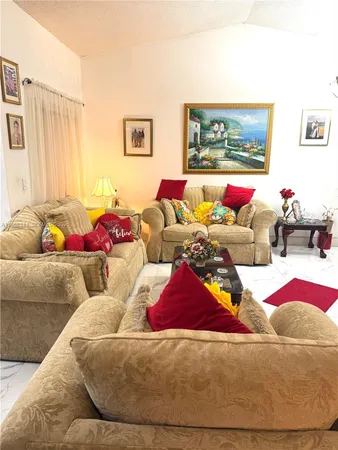 a living room with furniture and a couch