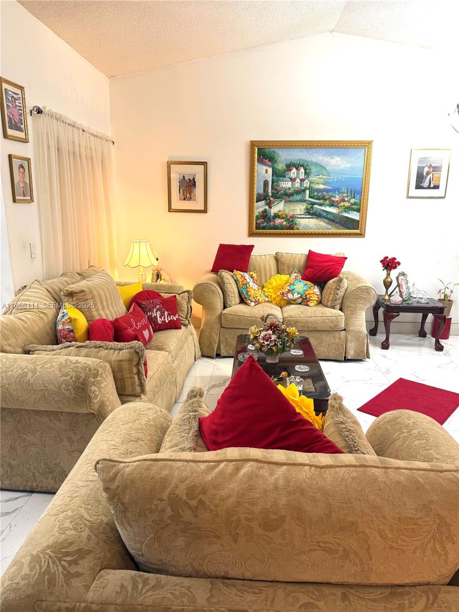 11266 Southwest 33rd Street Miami, FL 33165 - Photo 6 of 19 a living room with furniture and a couch