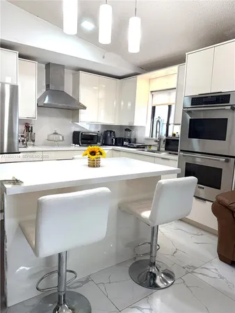 a living room with fireplace furniture and a flat screen tv