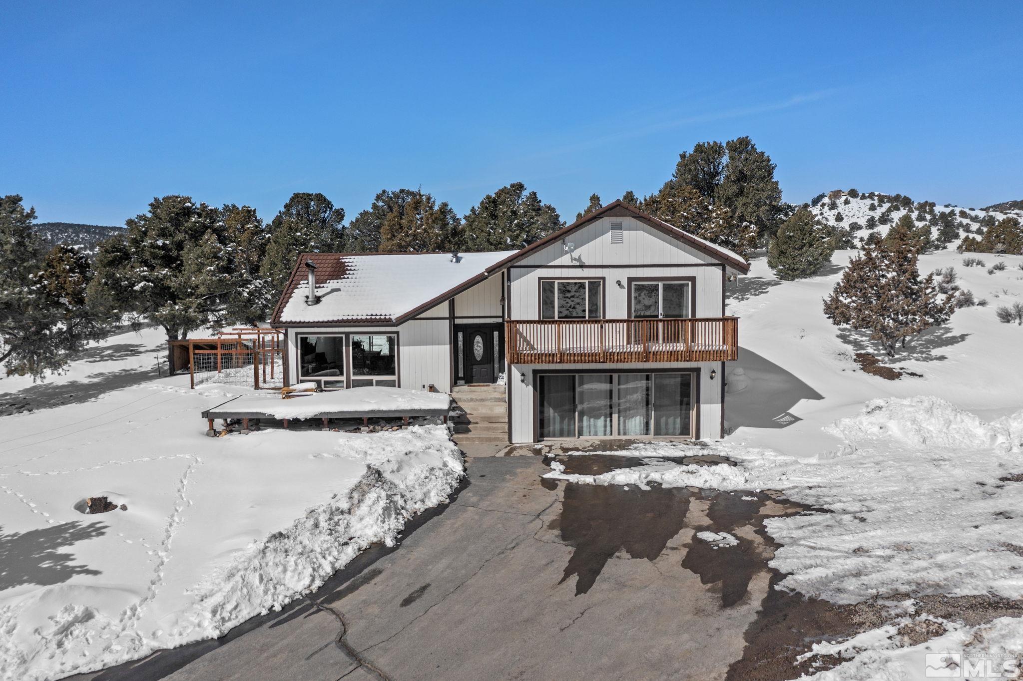 2440 Adobe Reno, NV 89521 - Photo 1 of 40 a view of a house with a snow in the background