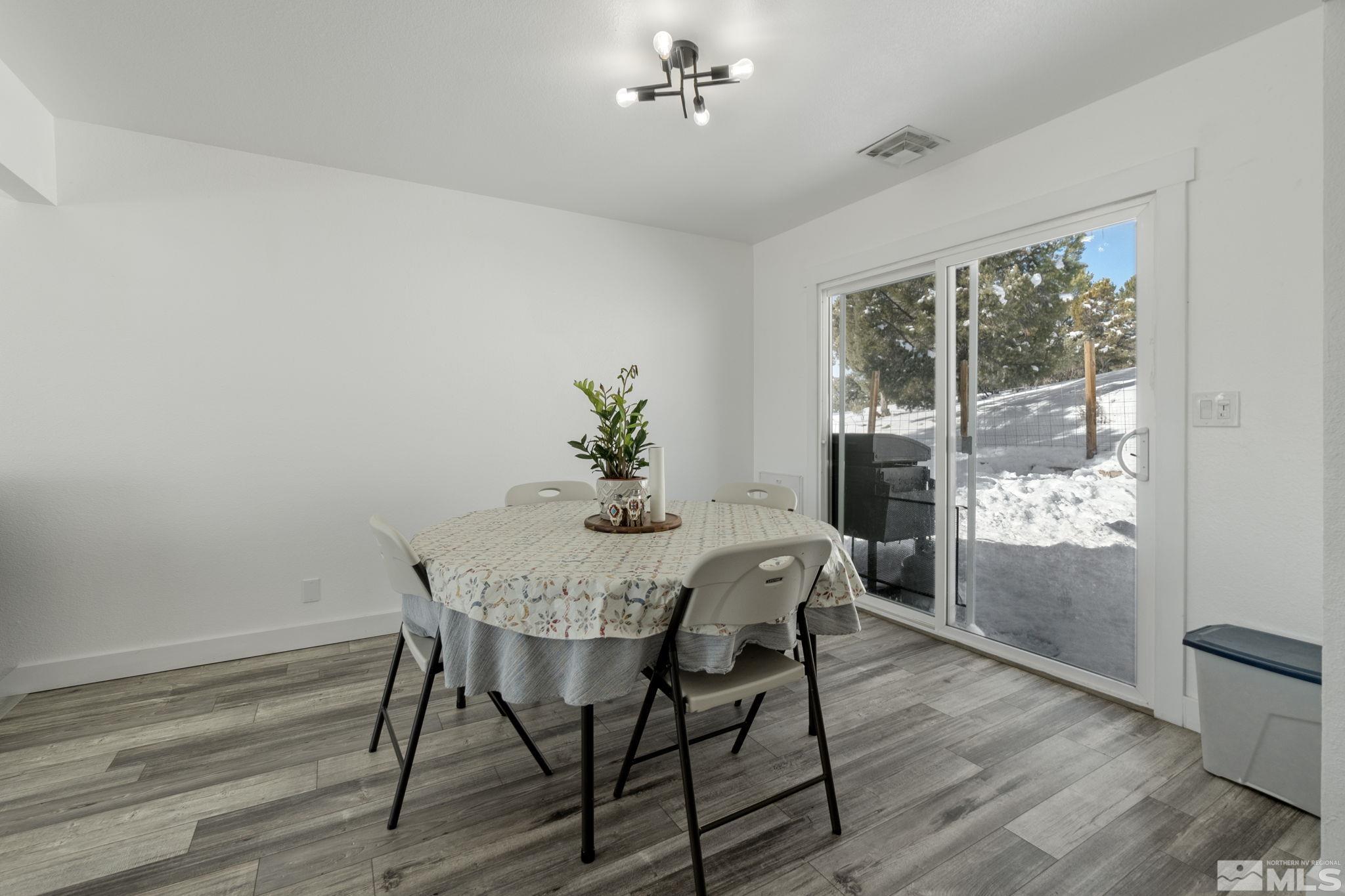 2440 Adobe Reno, NV 89521 - Photo 23 of 40 a view of a dining room with furniture window and wooden floor