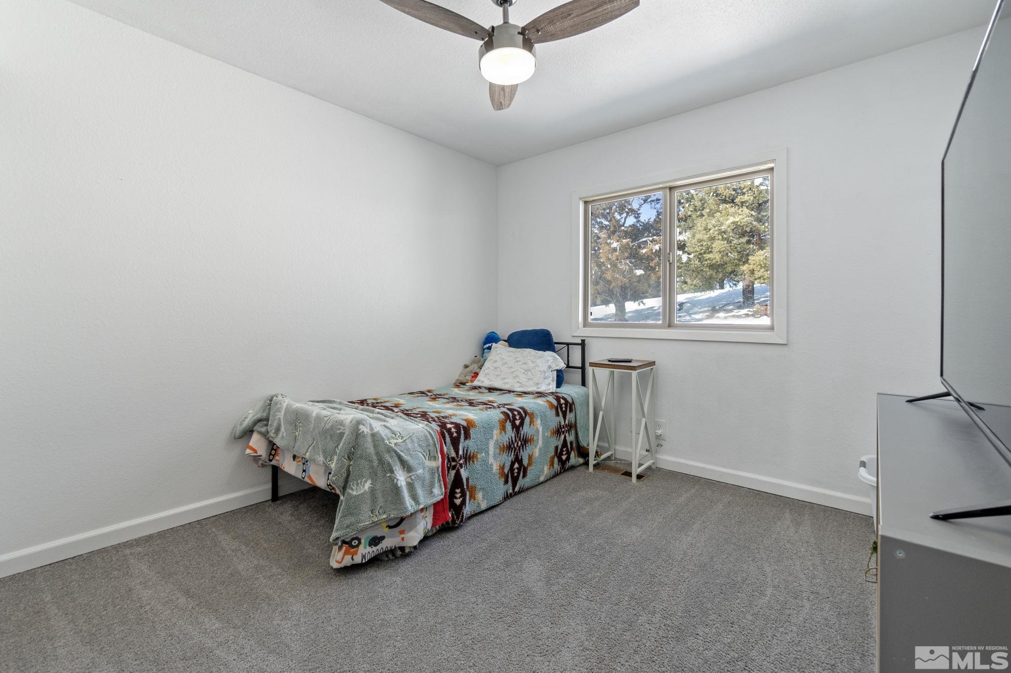 2440 Adobe Reno, NV 89521 - Photo 32 of 40 a bed sitting in a bedroom next to a window