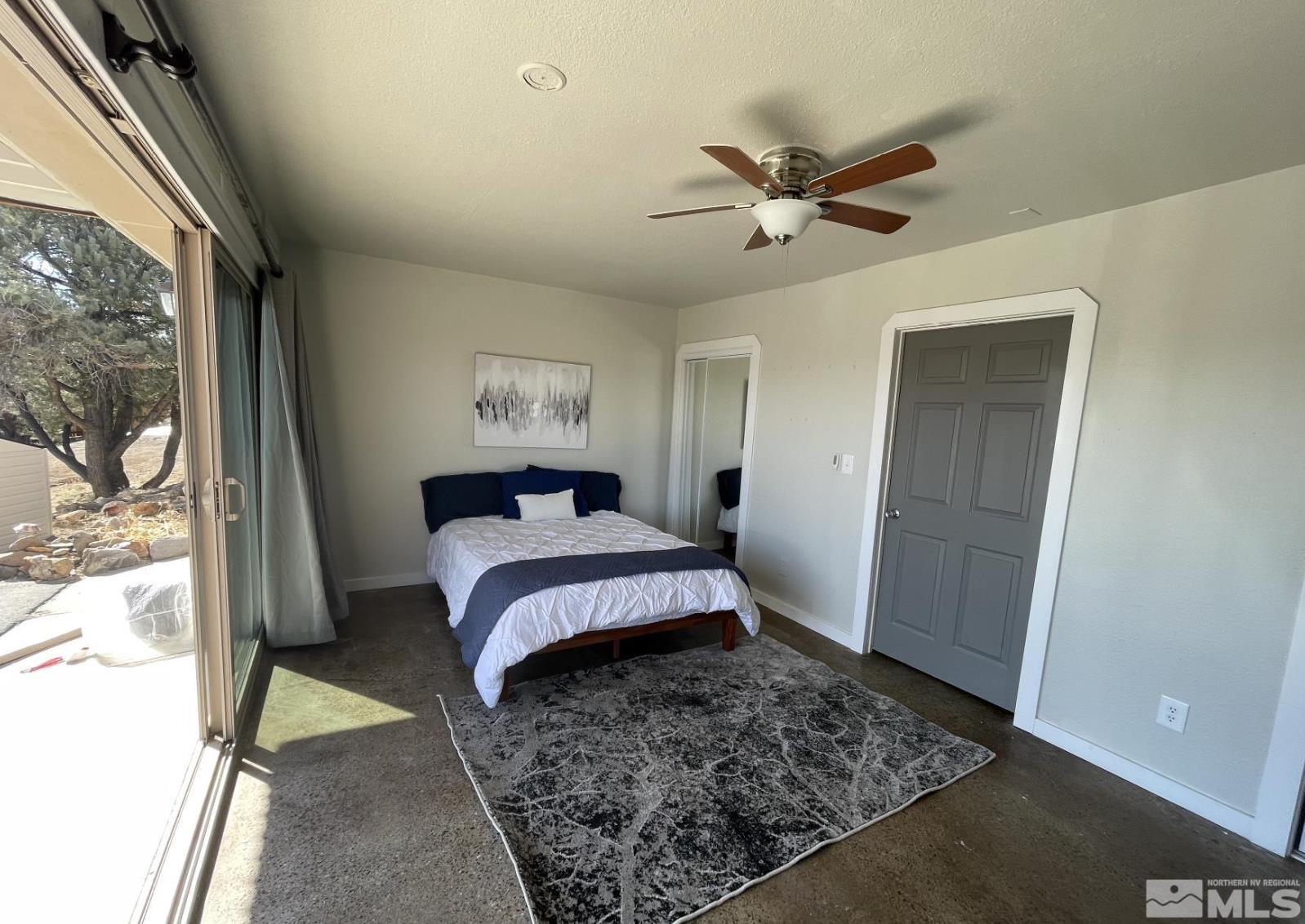 2440 Adobe Reno, NV 89521 - Photo 35 of 40 a bedroom with a bed and a window