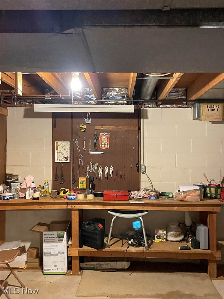 730 Phillips Road Northeast Massillon, OH 44646 - Photo 24 of 27 Basement featuring a workshop area