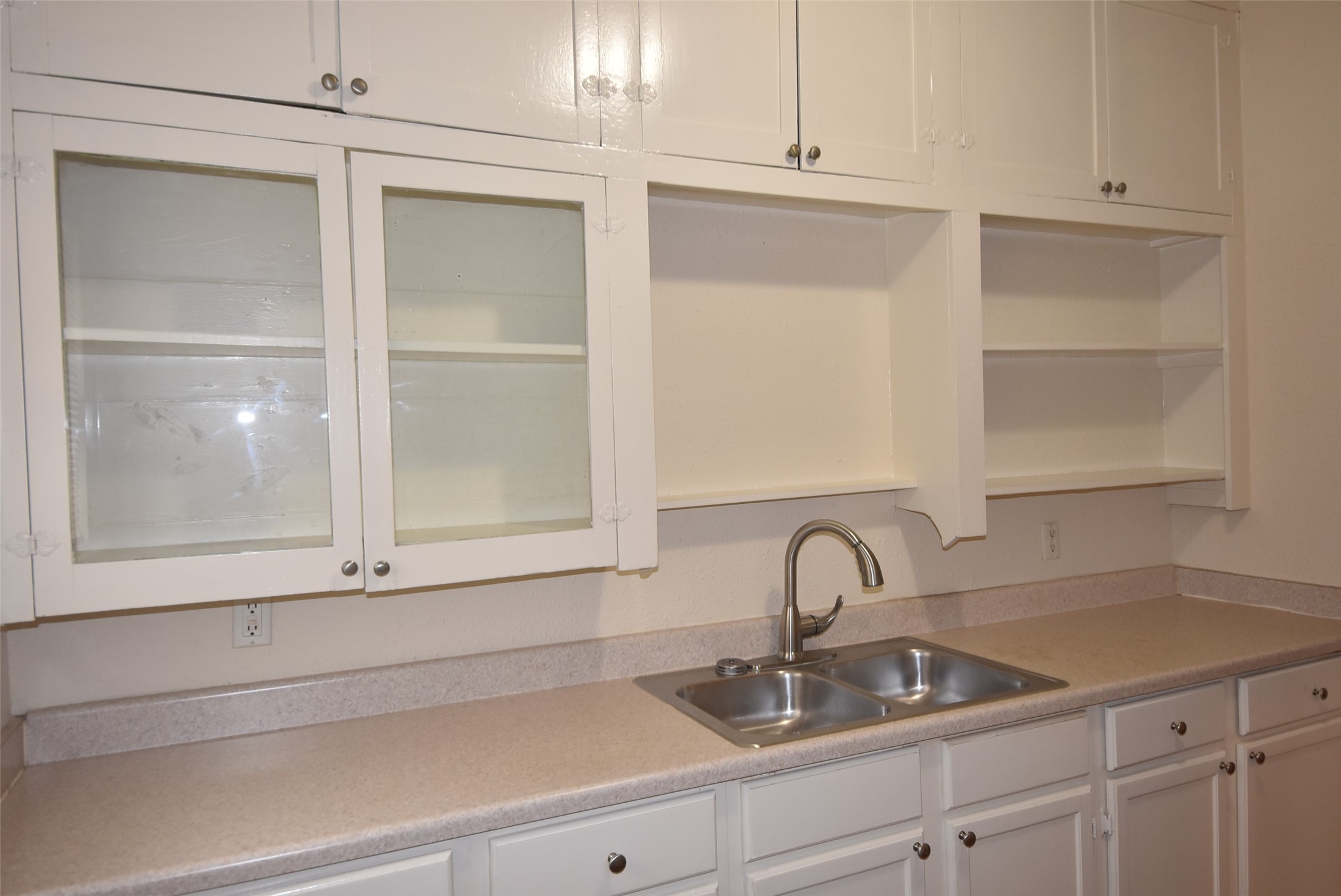 4618 Clay Street, Unit 2 Houston, TX 77023 - Photo 11 of 38 a close view of a sink and dishwasher with white cabinets