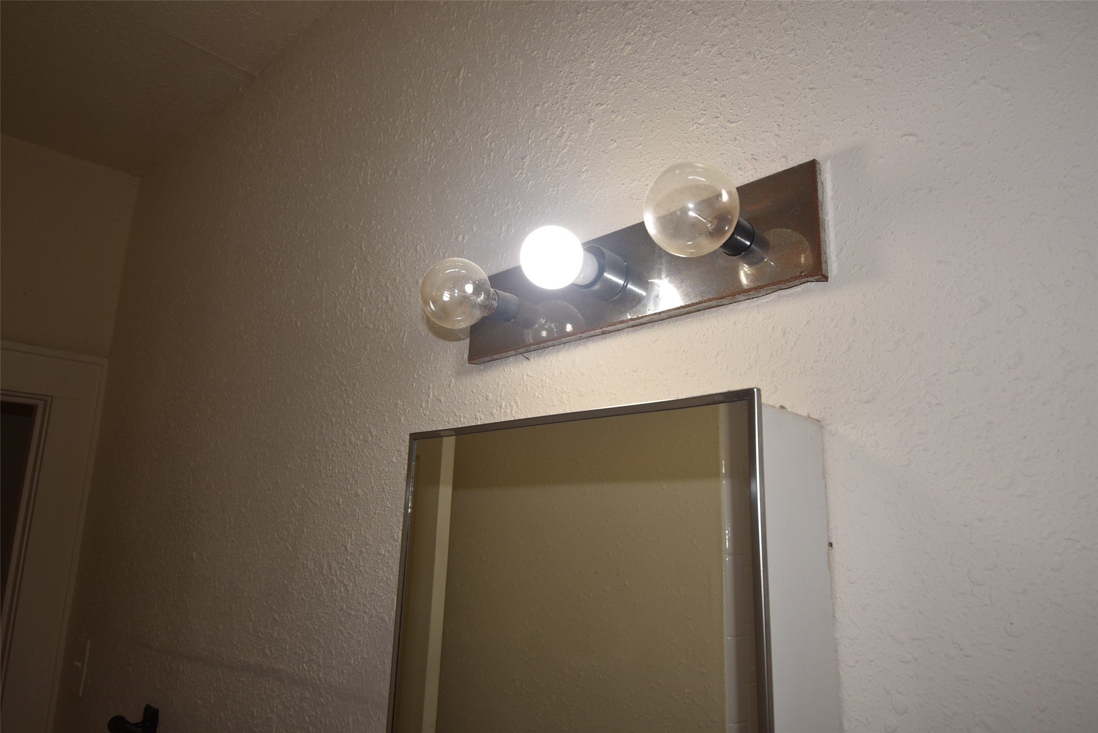 4618 Clay Street, Unit 2 Houston, TX 77023 - Photo 22 of 38 a lamp on a small space with a sink