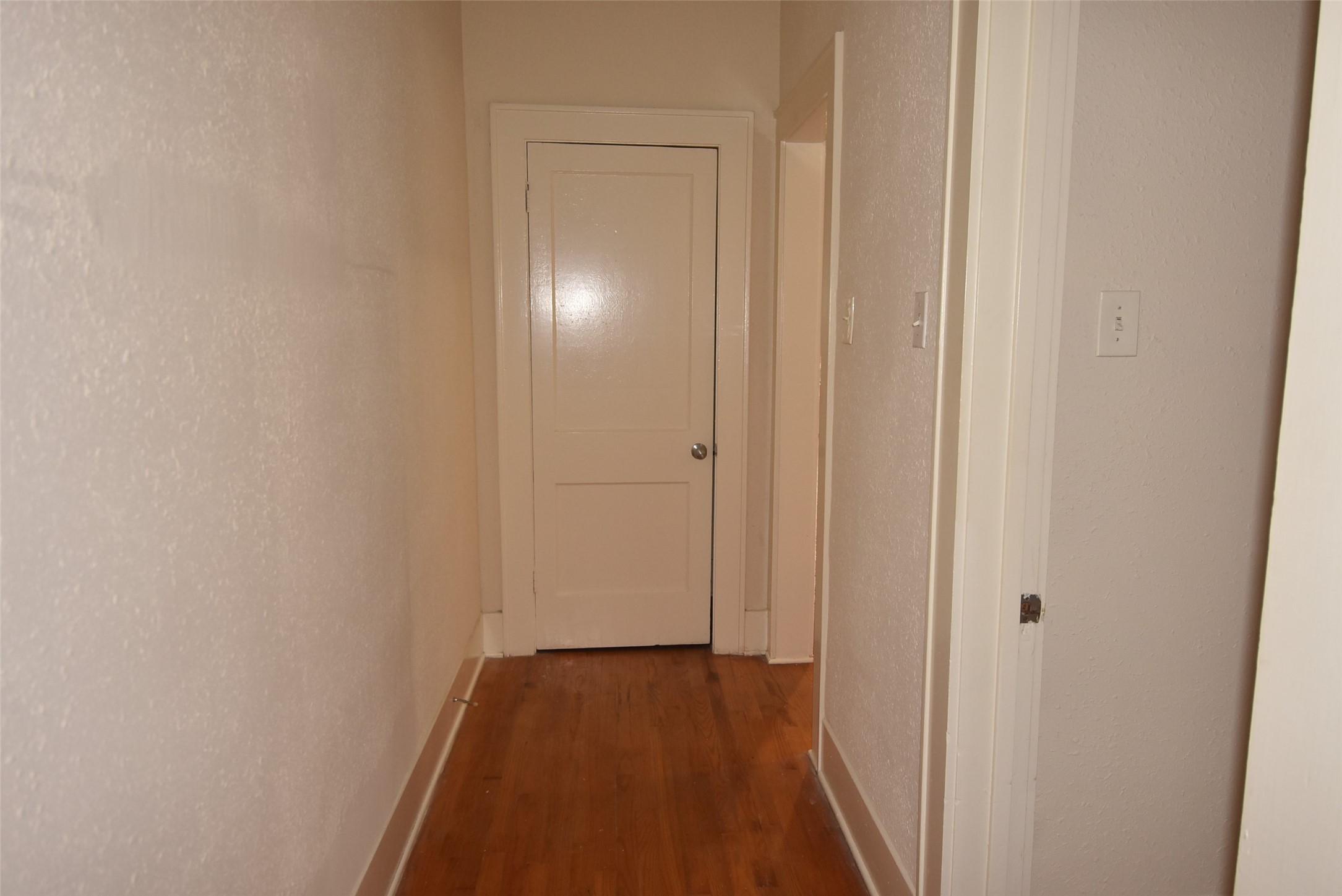 4618 Clay Street, Unit 2 Houston, TX 77023 - Photo 25 of 38 a view of a hallway with wooden floor