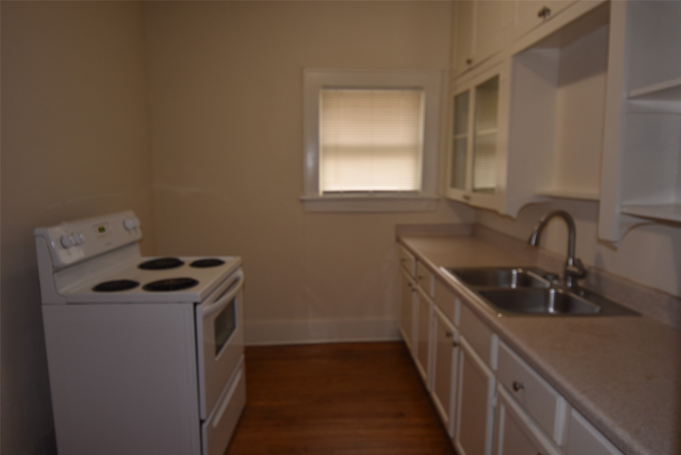 4618 Clay Street, Unit 2 Houston, TX 77023 - Photo 9 of 38 a kitchen that has a sink and a stove