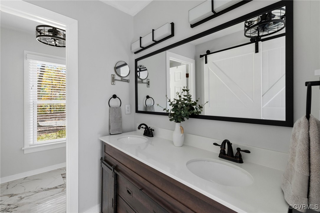 6209 Heather Glen Road Midlothian, VA 23112 - Photo 8 of 13 a bathroom with a sink and a mirror