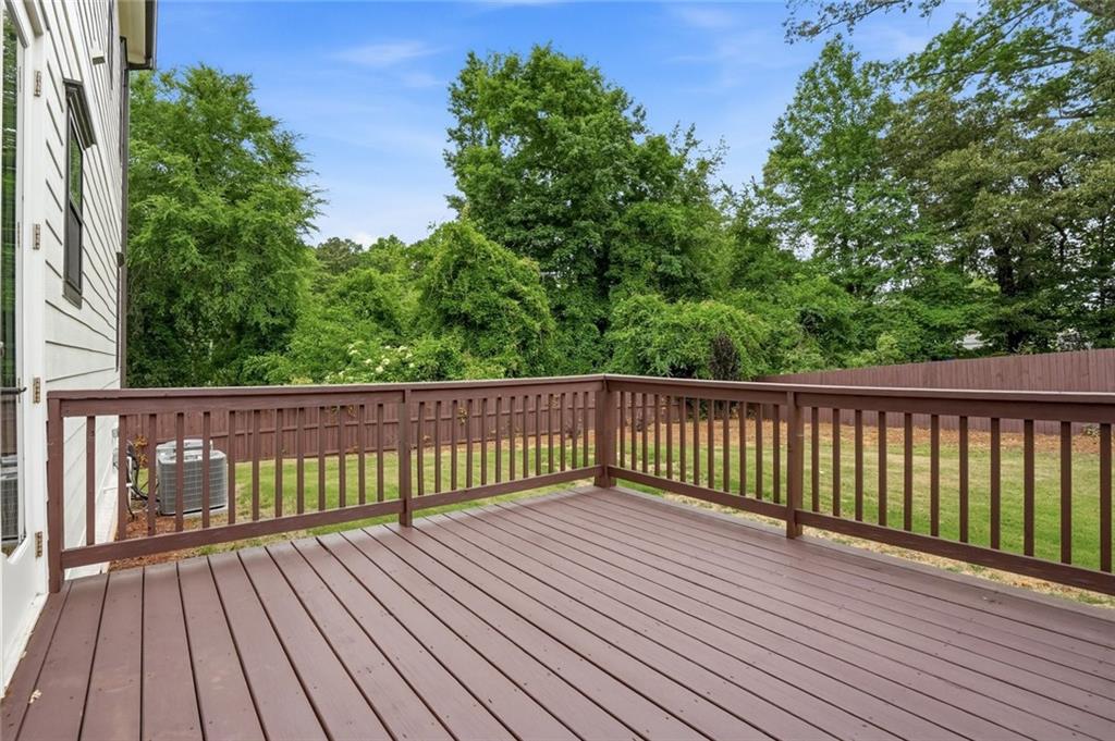 2415 West Rugby Avenue Atlanta, GA 30337 - Photo 38 of 40 a view of balcony with wooden floor and fence