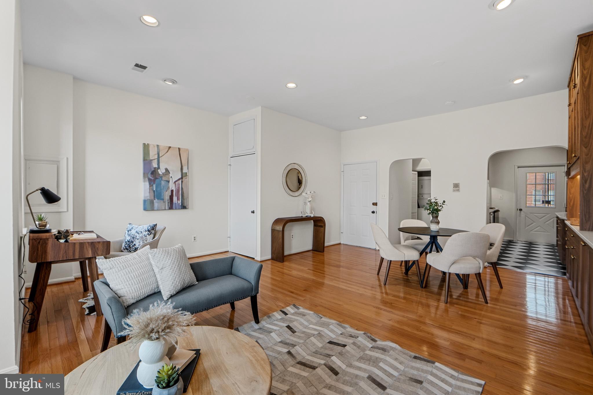 1927 15th Street Northwest Washington, DC 20009 - Photo 11 of 59 a living room with furniture a wooden floor and a rug