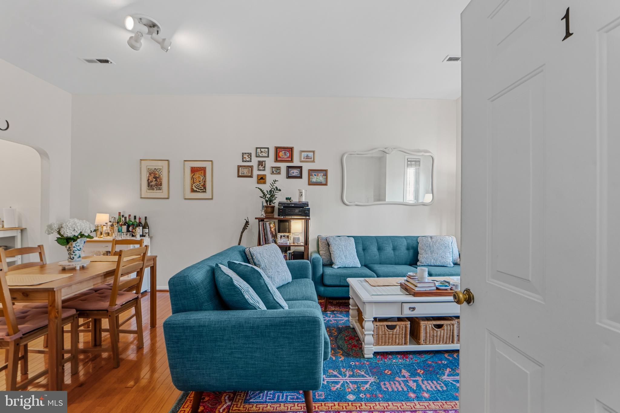 1927 15th Street Northwest Washington, DC 20009 - Photo 24 of 59 a living room with furniture and a wooden floor