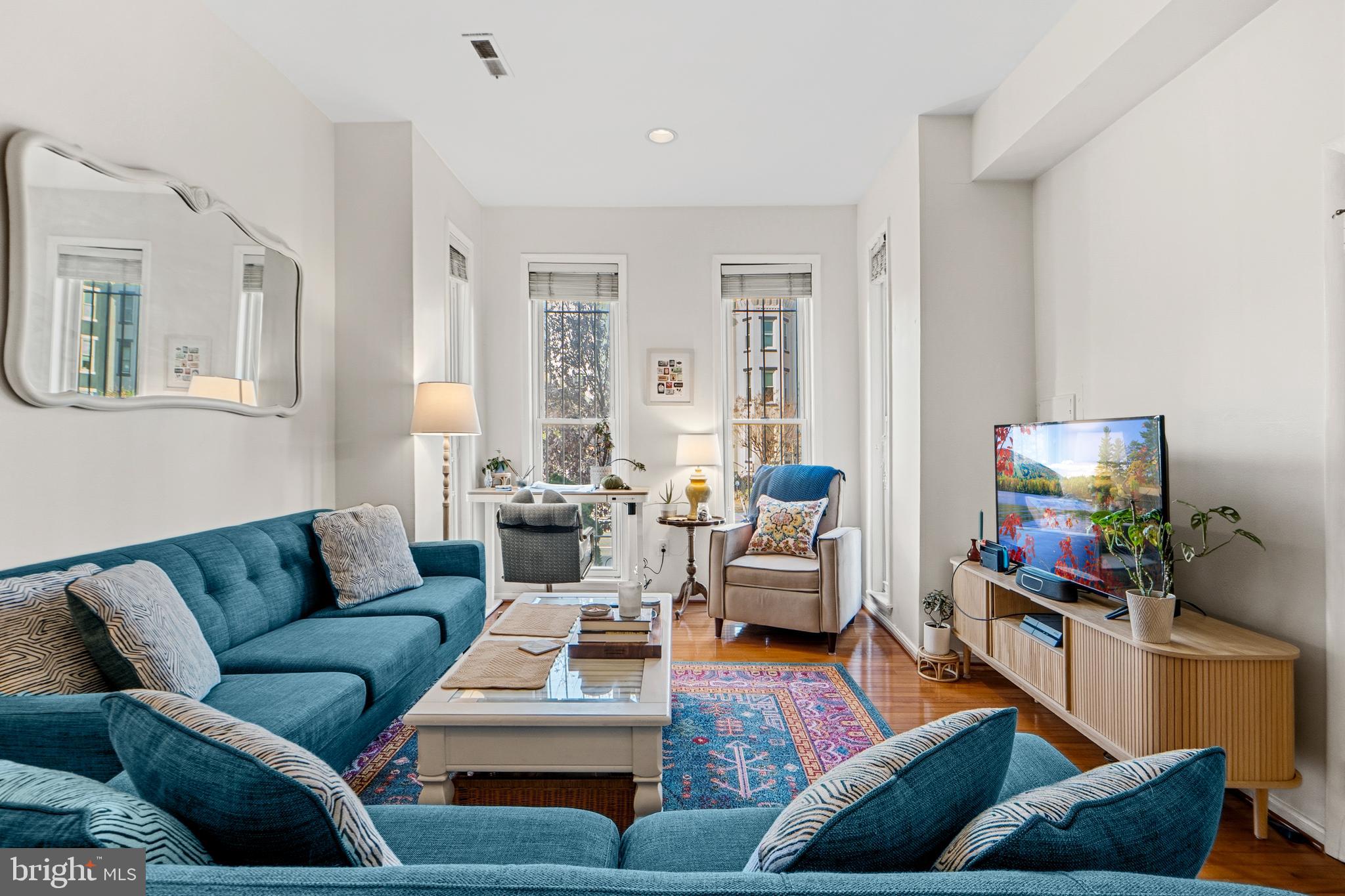 1927 15th Street Northwest Washington, DC 20009 - Photo 26 of 59 a living room with furniture or couch and a flat screen tv