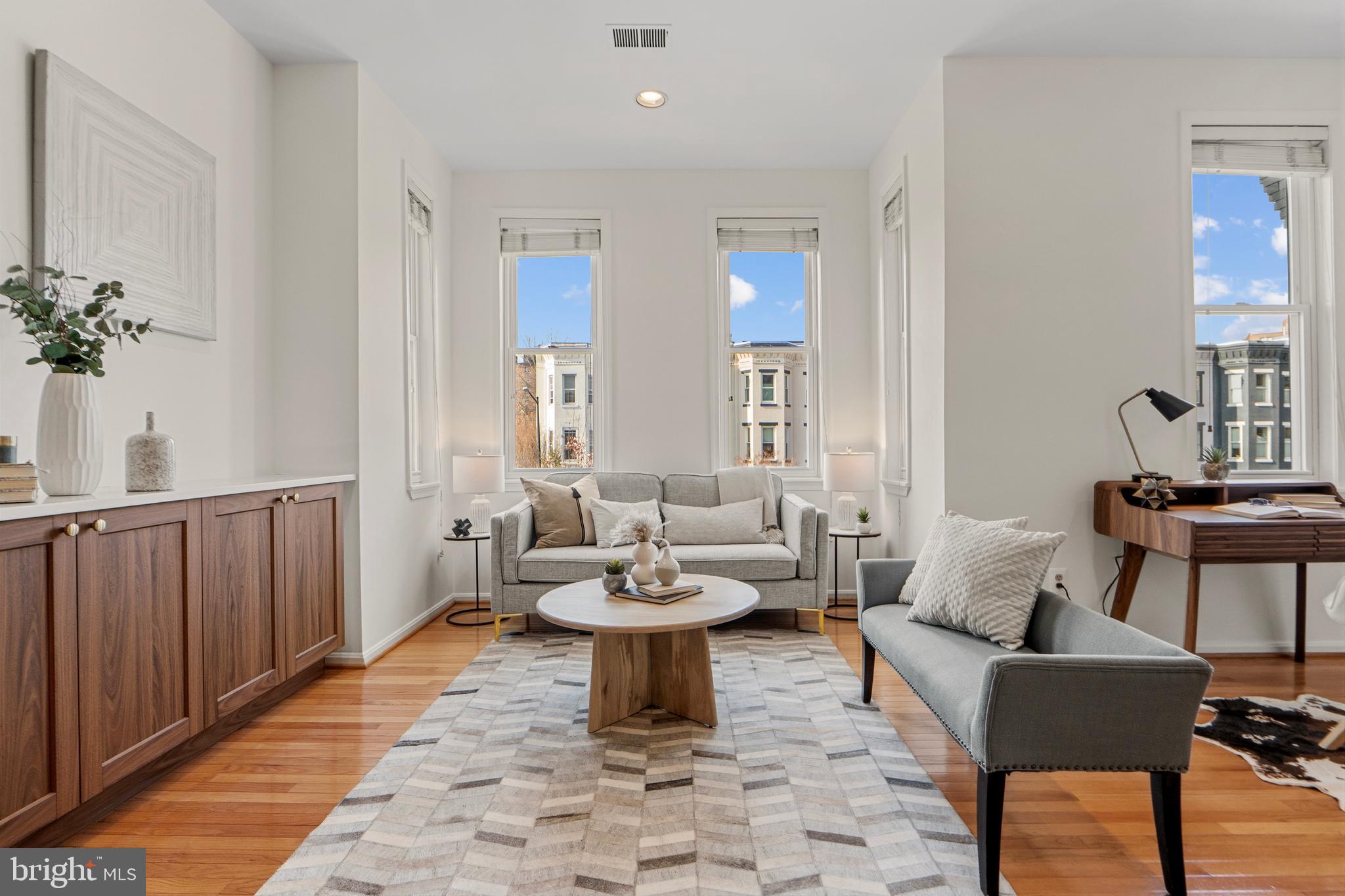 1927 15th Street Northwest Washington, DC 20009 - Photo 6 of 59 a living room with furniture and a potted plant