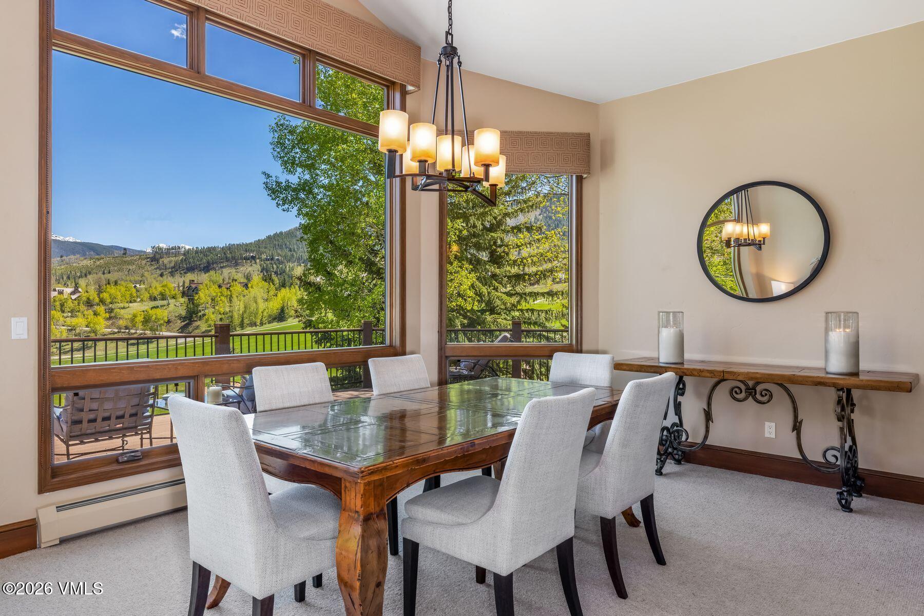 167 Saddle Ridge Edwards, CO 81632 - Photo 9 of 41 a view of a dining room with furniture window and outside view