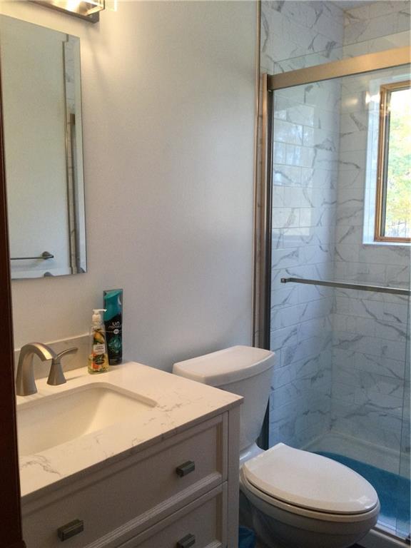 63 Ankrom Road Washington, PA 15301 - Photo 12 of 25 a bathroom with a sink a toilet and shower