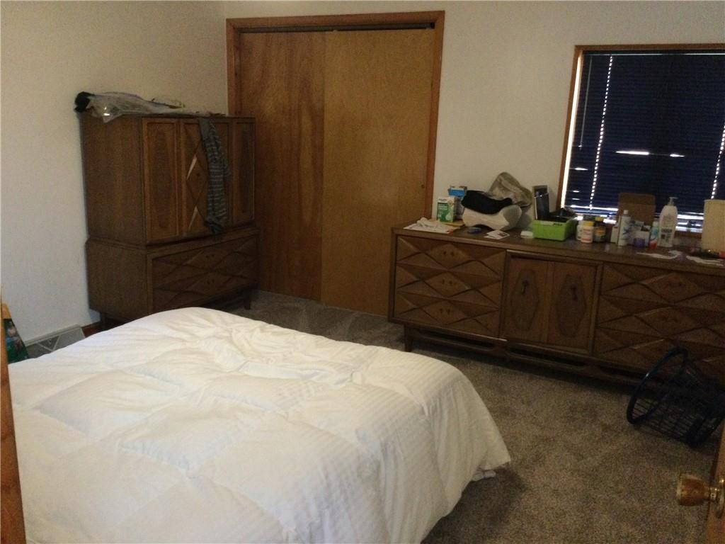 63 Ankrom Road Washington, PA 15301 - Photo 13 of 25 a bedroom with a bed and a mirror