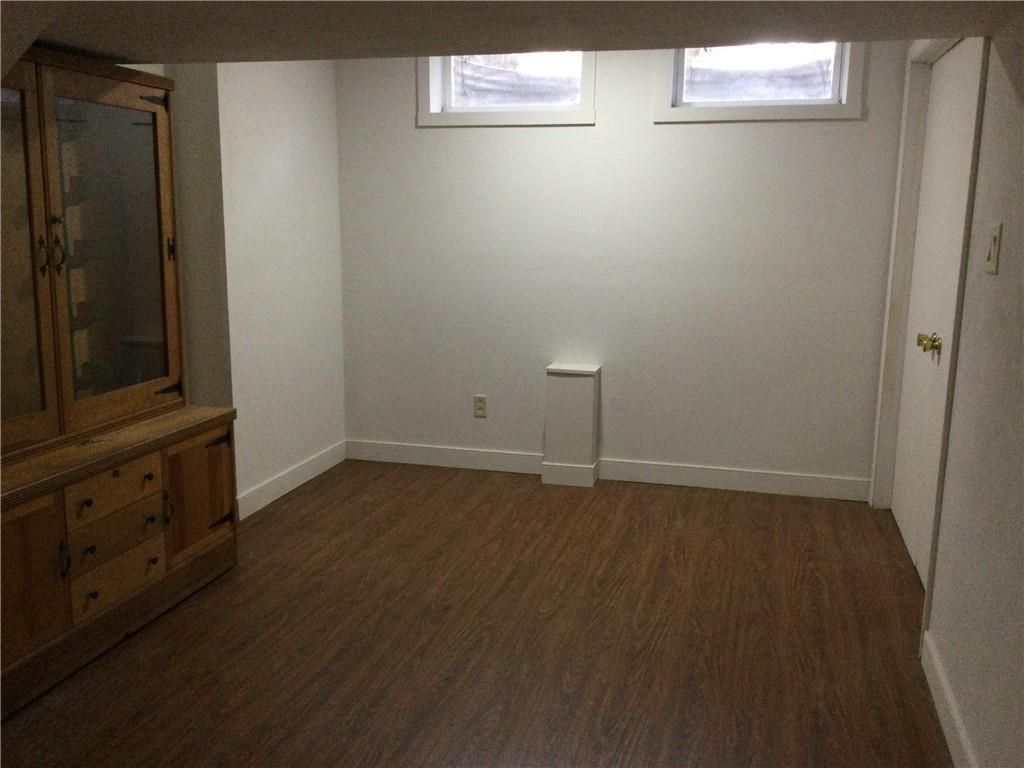 63 Ankrom Road Washington, PA 15301 - Photo 15 of 25 a view of an empty room with wooden floor and closet