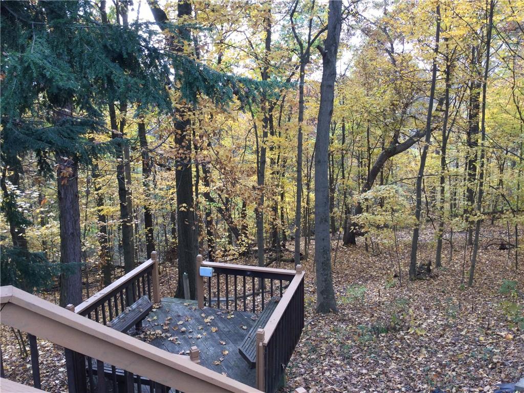 63 Ankrom Road Washington, PA 15301 - Photo 20 of 25 a view of a roof deck with wooden fence and trees
