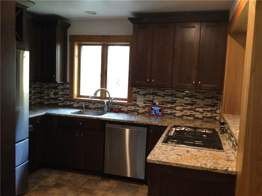 63 Ankrom Road Washington, PA 15301 - Photo 6 of 25 a kitchen with sink a stove and cabinets
