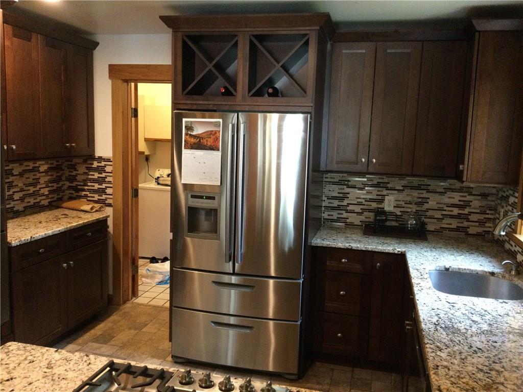 63 Ankrom Road Washington, PA 15301 - Photo 7 of 25 a kitchen with a refrigerator and cabinets