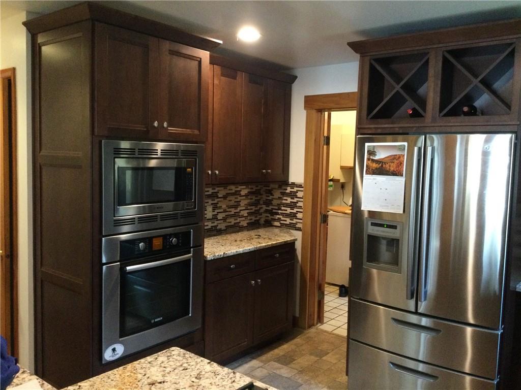 63 Ankrom Road Washington, PA 15301 - Photo 8 of 25 a kitchen with a refrigerator sink and cabinets