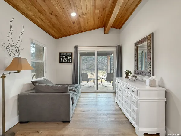 a bedroom with bed and window