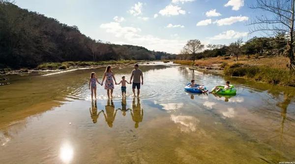 a kitchen that has a lot of cabinets in it and appliances