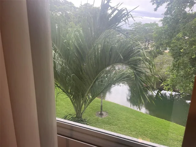 a view of a yard from a balcony