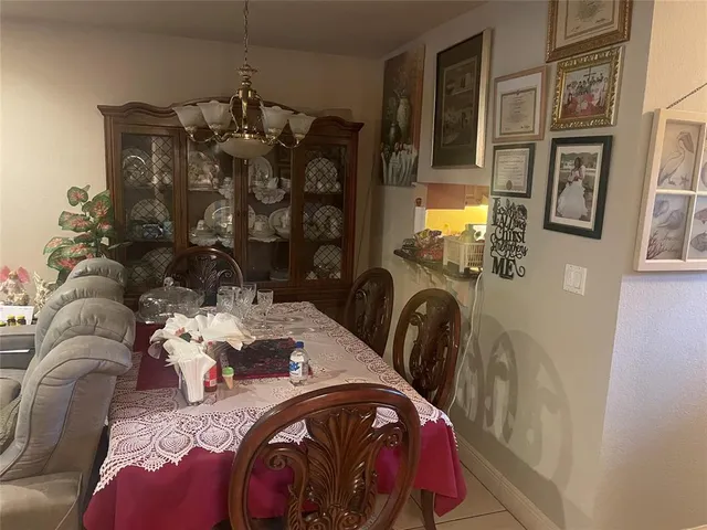 a bedroom with furniture and workout equipment