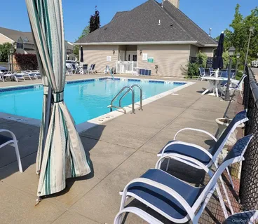 a view of a patio with swimming pool