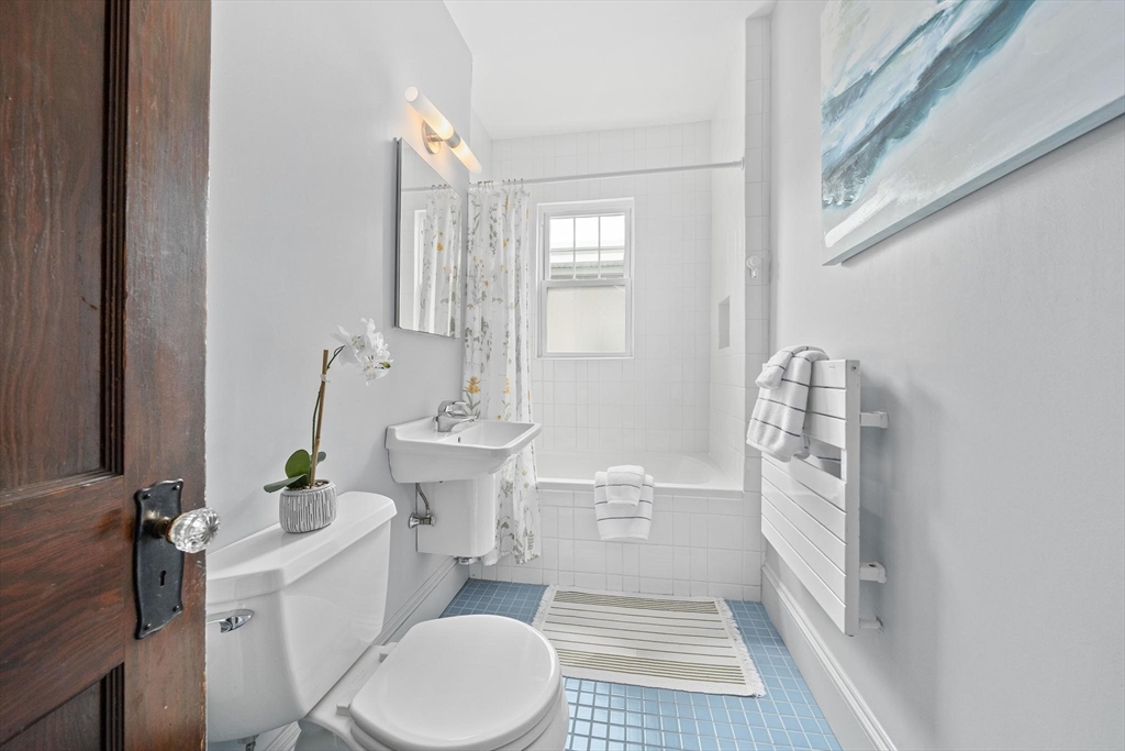 75 Parkton Road, Unit 3 Boston, MA 02130 - Photo 15 of 40 a bathroom with a sink a toilet a window and shower