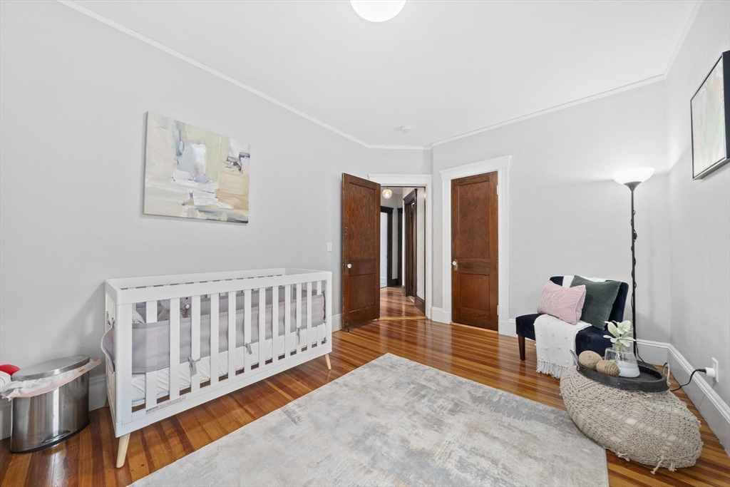 75 Parkton Road, Unit 3 Boston, MA 02130 - Photo 17 of 40 a bedroom with furniture and a book shelf