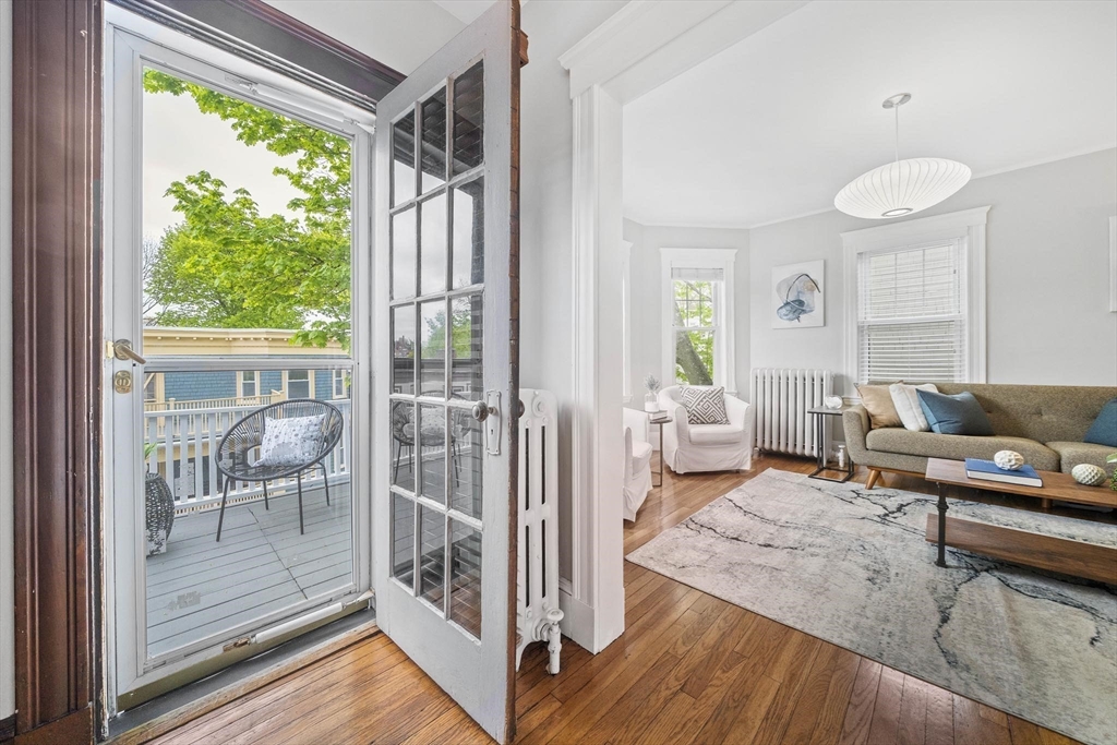 75 Parkton Road, Unit 3 Boston, MA 02130 - Photo 21 of 40 a living room with furniture and a wooden floor