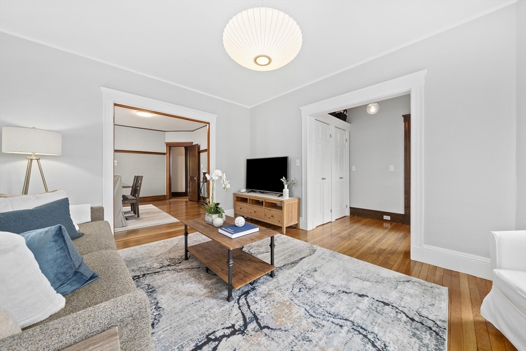 75 Parkton Road, Unit 3 Boston, MA 02130 - Photo 3 of 40 a living room with furniture and a flat screen tv