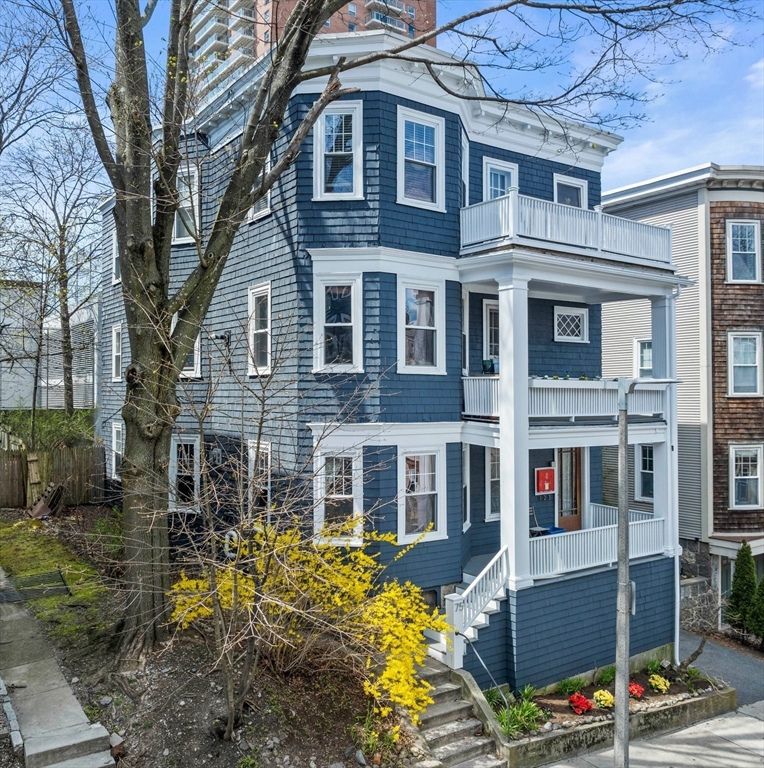 75 Parkton Road, Unit 3 Boston, MA 02130 - Photo 32 of 40 a front view of a residential apartment building with a yard