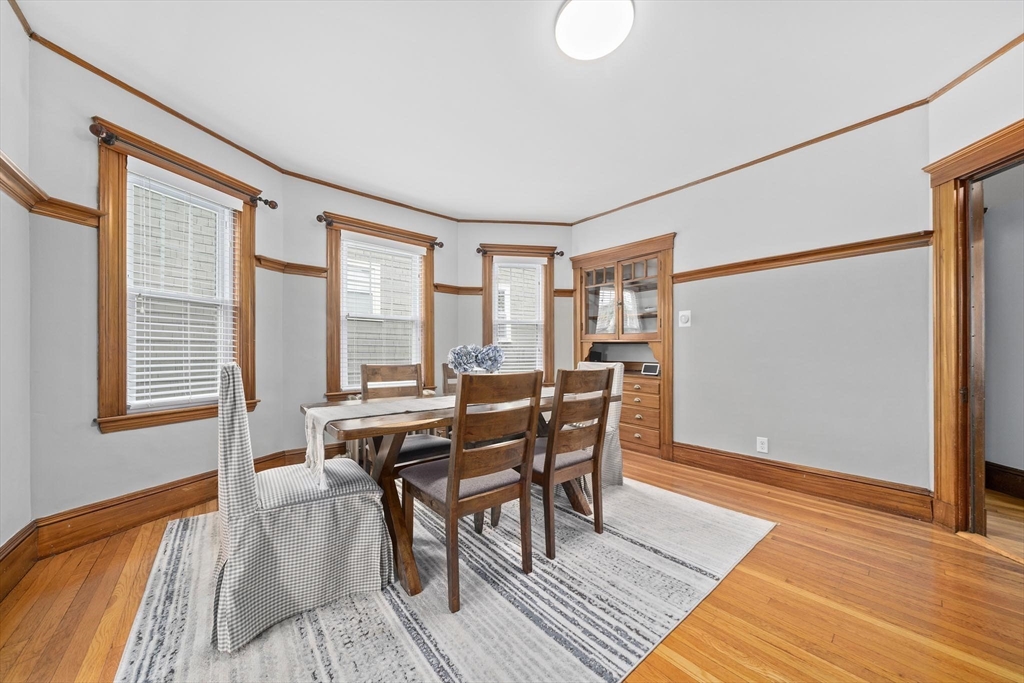 75 Parkton Road, Unit 3 Boston, MA 02130 - Photo 6 of 40 a view of a dining room with furniture and wooden floor