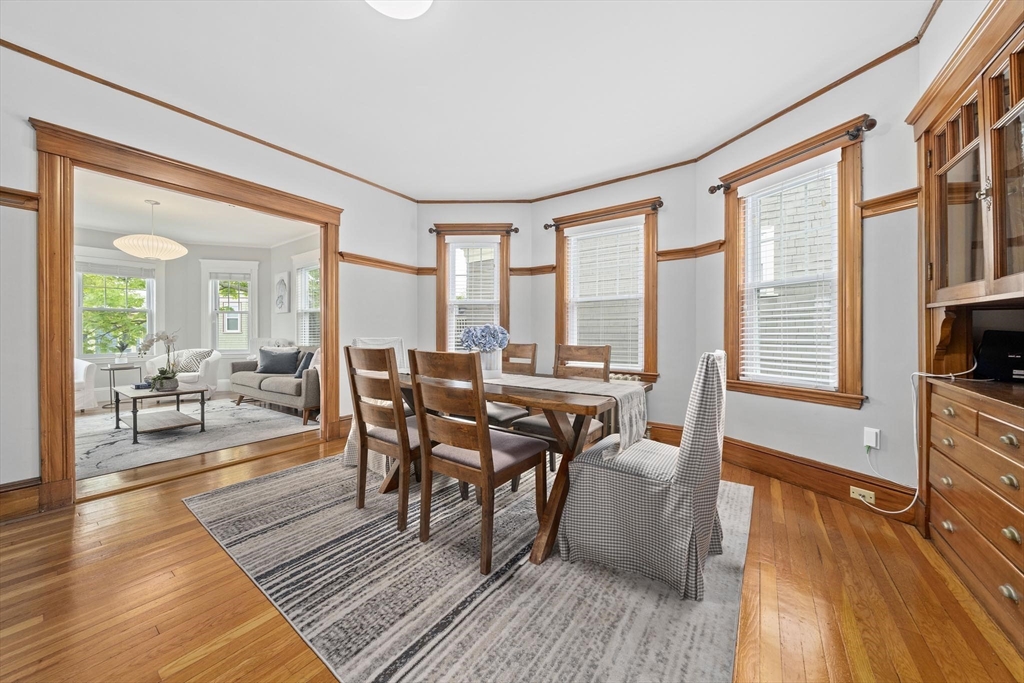 75 Parkton Road, Unit 3 Boston, MA 02130 - Photo 7 of 40 a dining room with wooden floor a glass table and chairs