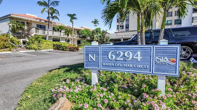 a sign that is sitting in front of a house