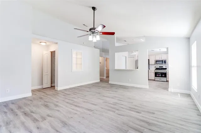a view of an empty room with a window