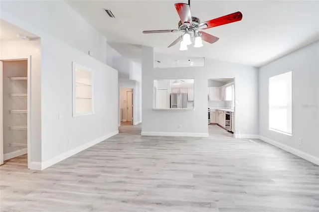 a view of an empty room with a window